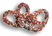 Milk chocolate pretzels covered in rainbow jimmies